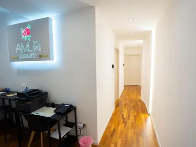 a room with a desk and a sign on the wall at Amuri Luxury Palermo centro in Palermo