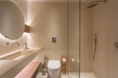 a bathroom with a toilet and a glass shower at Ammare Luxury Villa by Le Dhome Sicily in Trappeto