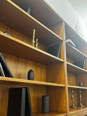 a wooden shelf with vases and other items on it at Large two-room apartment within walking distance of the Teatro Massimo in Palermo