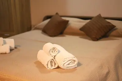 a couple of towels on a bed at Ballarua in Palermo