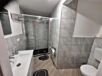 a bathroom with a shower and a toilet and a sink at Tra I Normanni E Cattedrale Apartament Palermo in Palermo