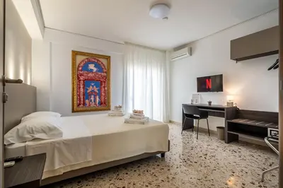 a hotel room with two towels on a bed at Centoquaranta Apartment in Terrasini