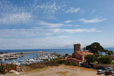 a view of a harbor with boats in the water at Donna Rosalía Apartments in Trabia
