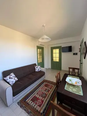 a living room with a couch and a table at Villa Mediterranea in Carini