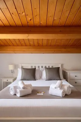 a bedroom with a bed with towels on it at DhOME Apartment in Palermo