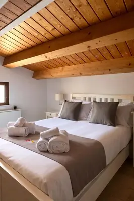 a bedroom with a bed with dolls on it at DhOME Apartment in Palermo