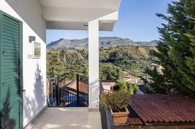 a view from the balcony of a house with mountains in the background at Luce mediterranea a Monreale in Monreale