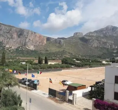 a view of a town with mountains in the background at il limone appartamenti 2 in San Vito lo Capo