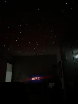 a room with a lit up sign in the dark at La casa del Cavaliere in Palermo