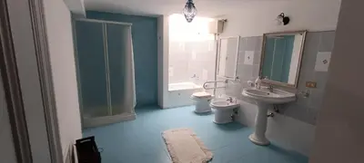a bathroom with a sink and a toilet at Beneath the Castle in Corleone