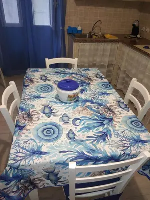 a table with a blue and white table cloth on it at Casa Ferdinando e Maria in Palermo