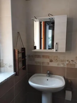 a bathroom with a sink and a mirror at Corleone bed and breakfast in Corleone