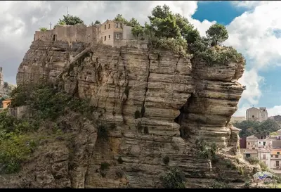 a building on the top of a mountain at Corleone bed and breakfast in Corleone