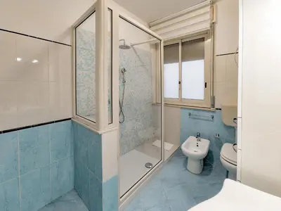 a bathroom with a shower and a toilet and a sink at Casa Belsito in Palermo