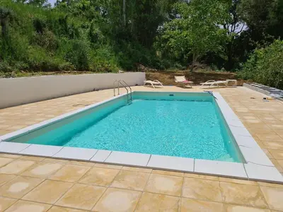 a large swimming pool with a tiled patio at Casa vacanze dispensa San Pietro in Calatafimi