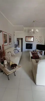 a living room with a couch and a table at Casa vacanze dispensa San Pietro in Calatafimi