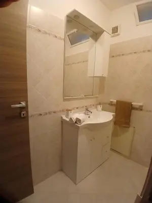 a bathroom with a sink and a mirror at La casetta di Cecilia in Palermo