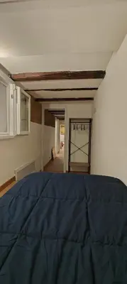 a bedroom with a blue bed in a room at Sammartino Apartment in Palermo