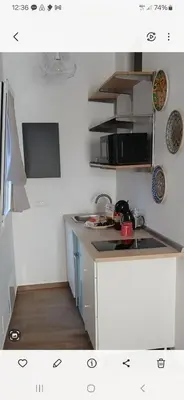 a kitchen with a sink and a stove top oven at Esse & Emme in Palermo