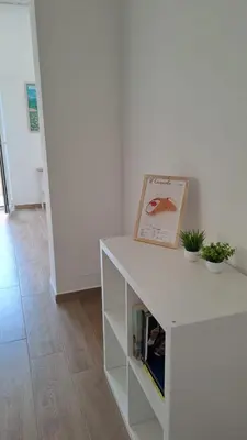 a white cabinet with a picture on top of it at Esse & Emme in Palermo