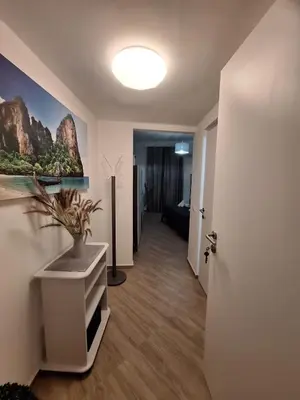 a hallway with a room with a plant on a wall at Normanni Deluxe Room Palermo in Palermo