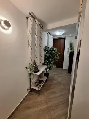 a hallway with potted plants in a room at Normanni Deluxe Room Palermo in Palermo