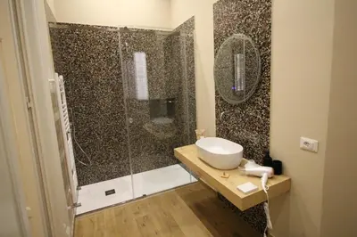 a bathroom with a sink and a shower at Leoni di Sicilia in Palermo