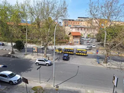 an aerial view of a street with cars and buses at Cattedrale Superior Room plus Terrace Palermo in Palermo