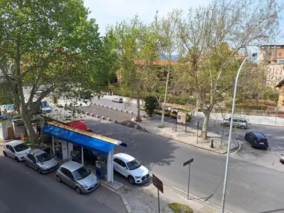 a gas station with cars parked in front of it at Cattedrale Superior Room plus Terrace Palermo in Palermo