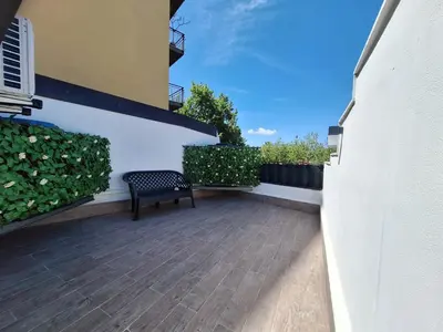 a patio with a bench on the side of a building at Cattedrale Superior Room plus Terrace Palermo in Palermo