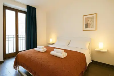 a bedroom with a bed with two towels on it at Casetta di Giulio in Palermo