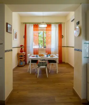 a dining room with a table and chairs at Villa Yasmine in Cinisi