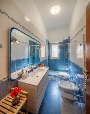 a bathroom with a tub and a toilet and a sink at Villa Yasmine in Cinisi