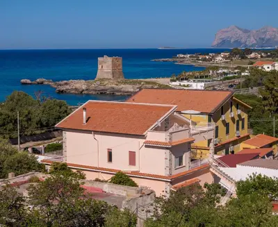 a view of a town with a castle in the distance at Villa Yasmine in Cinisi