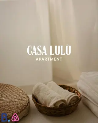 a bathroom with two towels in a basket at Casa Lulú in Palermo
