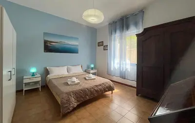 a bedroom with a bed with two lamps on it at Stunning Apartment In Balestrate in Balestrate