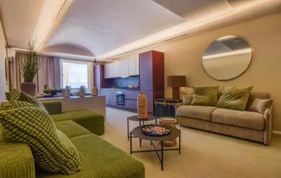 a living room with two couches and a table at 5 Bedroom Stunning Apartment In Trappeto in Trappeto