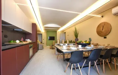 a kitchen and dining room with a table and chairs at 5 Bedroom Stunning Apartment In Trappeto in Trappeto