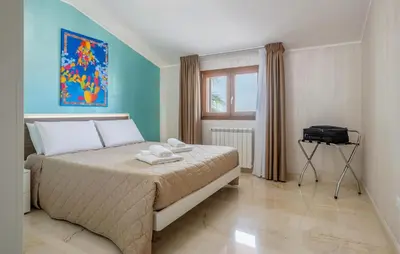 a bedroom with a bed with two towels on it at Beautiful Apartment In Balestrate in Balestrate