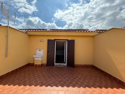 a house with a toilet on the side of it at Aspra Mare House in Ficarazzi