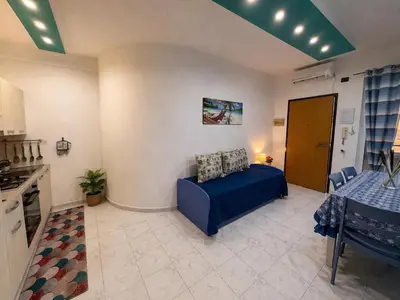 a bedroom with a bed with towels on it at Rossella Apartment 5 posti vicino spiaggia San Vito Lo Capo in San Vito lo Capo