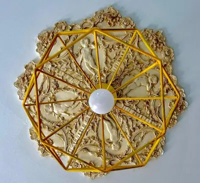 a gold mandala with a white pearl in the middle at Casa Mortillaro - The Heart of Palermo, Ballaro Market in Palermo