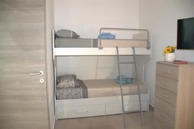 a bedroom with two bunk beds and a dresser at Sweet dreams AF in Palermo