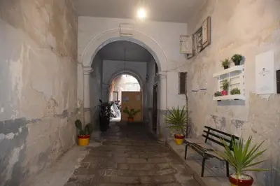 an empty hallway with a bench and potted plants at Sweet dreams AF in Palermo