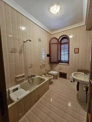 a bathroom with a tub and a toilet and a sink at IL GEKO tra Palermo e Cefalu' nel mare di Sicilia in Trabia