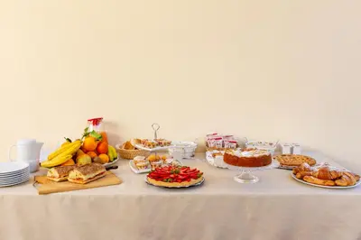a table with many different types of food on it at Bed&Breakfast Acasamia in Castelluzzo