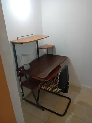 a desk and a chair in a room at Capo in Palermo