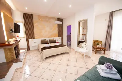 a large room with a bed and a couch at From Flori in Terrasini
