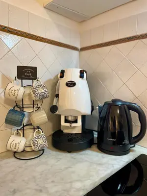 a coffee maker and a tea kettle on a counter at CasaPA-Appartamento a due passi dal Teatro Massimo in Palermo