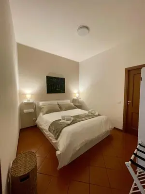 a bedroom with a bed with two towels on it at CasaPA-Appartamento a due passi dal Teatro Massimo in Palermo
